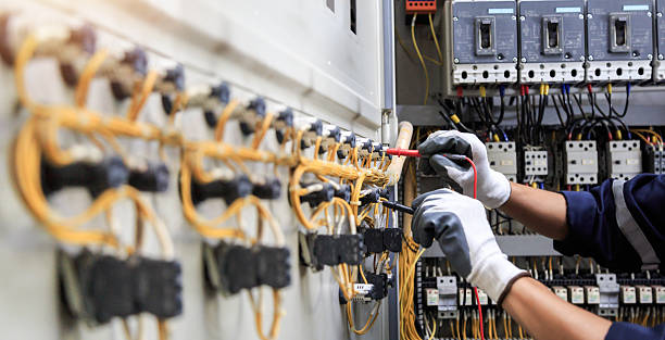 Professional Electrician technician working in Ferry Pass, FL